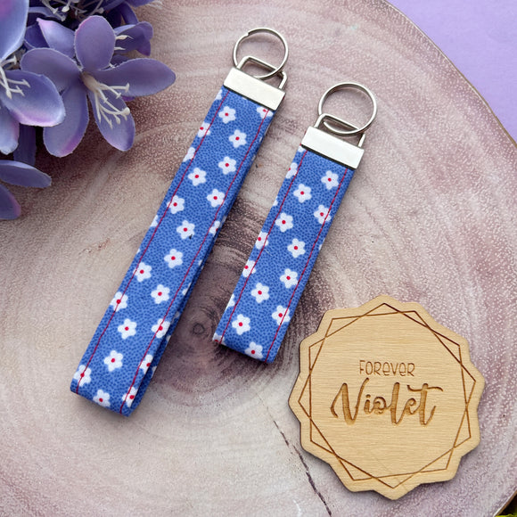 White Daisies on Blue Wristlet