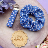 White Daisies on Blue Wristlet